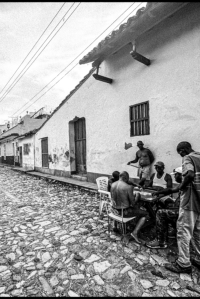 Group of men playing board games on the streets of Trinidad, Cuba