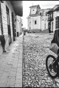Cuban kid riding his bike on the streets of Trinidad, Cuba