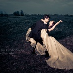 Wedding couple dancing in field