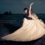 Wedding couple dancing in field