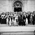 Wedding group shot with bicycles passing