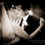 Bride and Groom kissing sepia cinematic