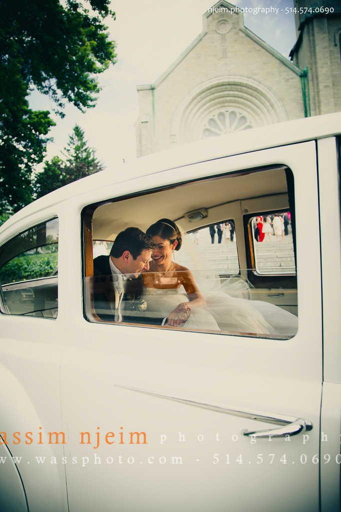 Bride and Groom in Limousine in front of church in Mont-Royal
