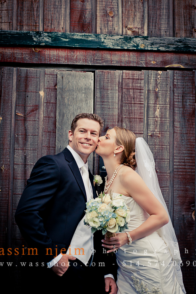 Bride kissing groom in Mont-Tremblant
