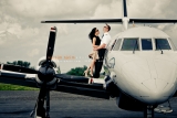 Wedding couple on airplane wing in Montreal