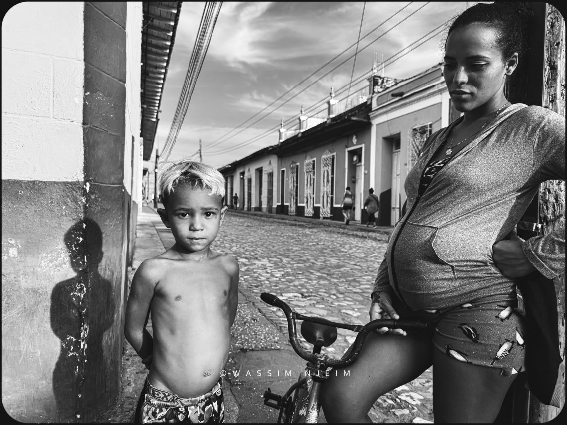 Photograph of a mother and her child on the streets of Trinidad Cuba